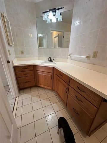 a lobby with furniture and a table