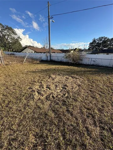 a view of a kitchen with an empty space and a window