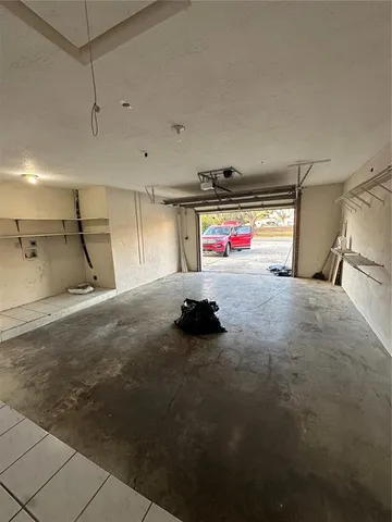 a view of a kitchen with a sink and cabinets