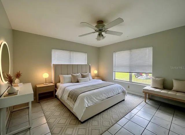 a bedroom with a bed and window