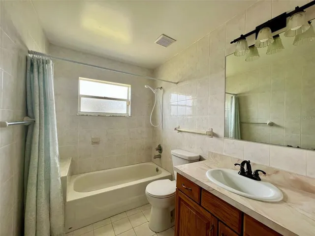 a kitchen with stainless steel appliances a refrigerator sink and cabinets