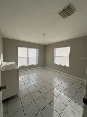 a view of a livingroom with a dishwasher and a window