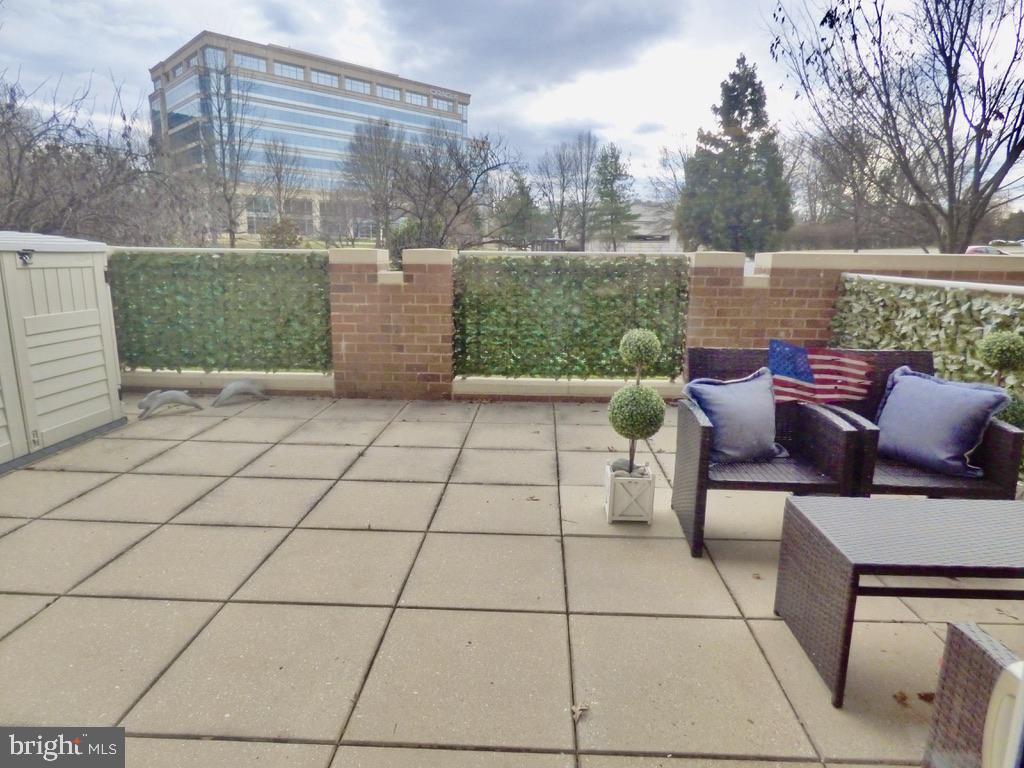 11800 Sunset Hills Road, Unit 118 Reston, VA 20190 - Photo 31 of 52 Charming patio with urban views.