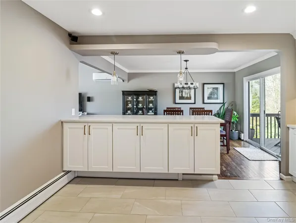 a large kitchen with stainless steel appliances granite countertop a stove top oven a refrigerator and a sink