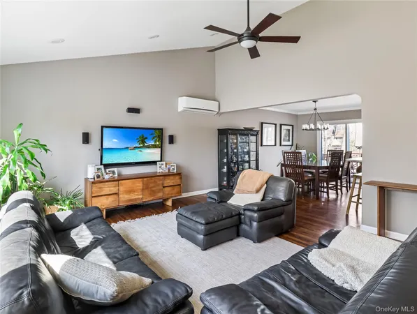 a view of a hallway with wooden floor and entryway