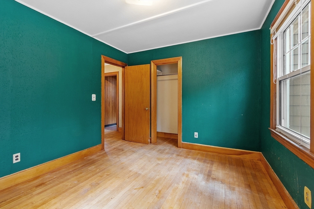 490 South Main Street Orange, MA 01364 - Photo 12 of 37 a view of an empty room with window and stairs