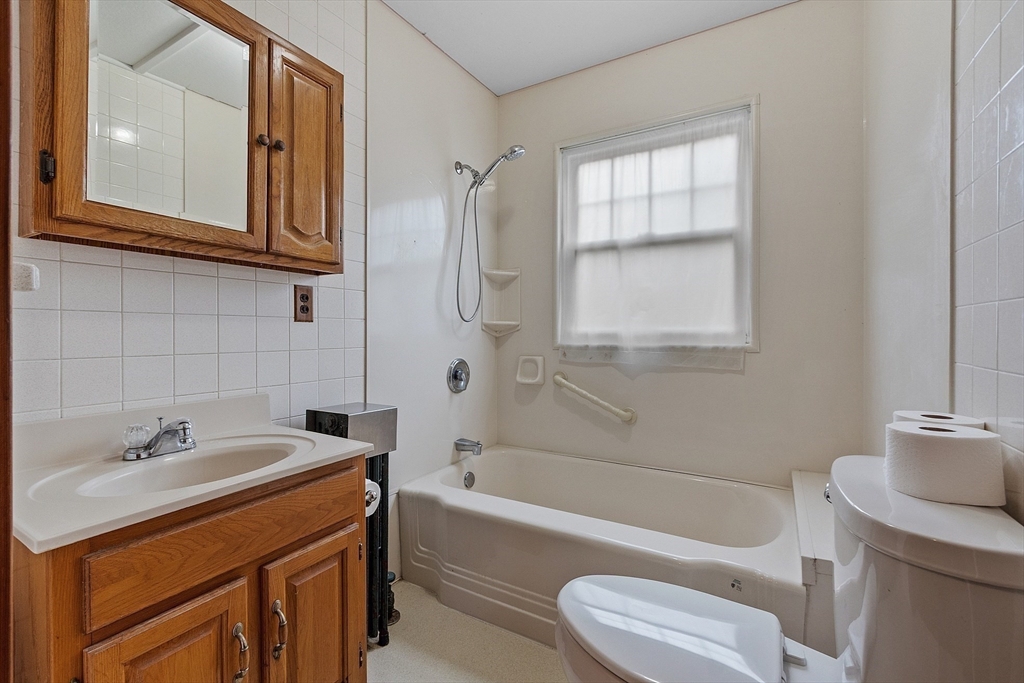 490 South Main Street Orange, MA 01364 - Photo 14 of 37 a bathroom with a sink a toilet and bathtub