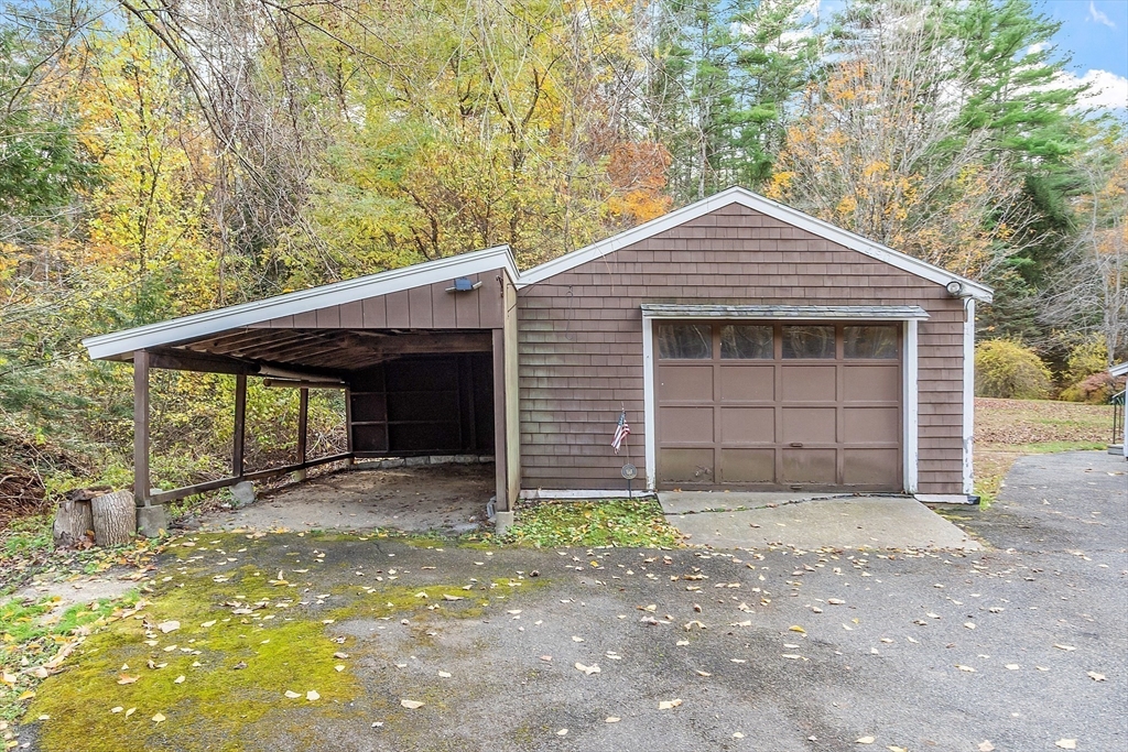490 South Main Street Orange, MA 01364 - Photo 25 of 37 a front view of a house with a yard and garage