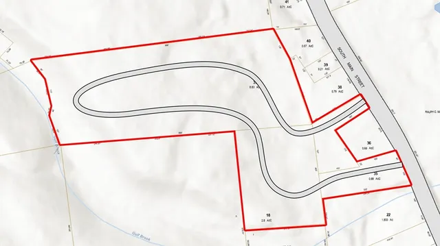 a utility room with dryer and mirror