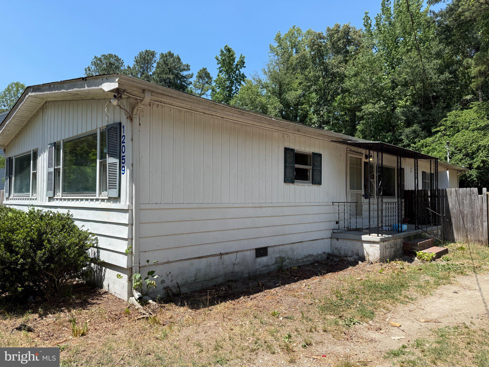 12059 Red Pine Road Ruther Glen, VA 22546 - Photo 2 of 2 Charming home nestled in nature's embrace.