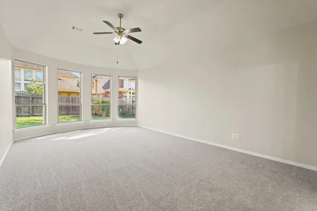 a view of an empty room with a window