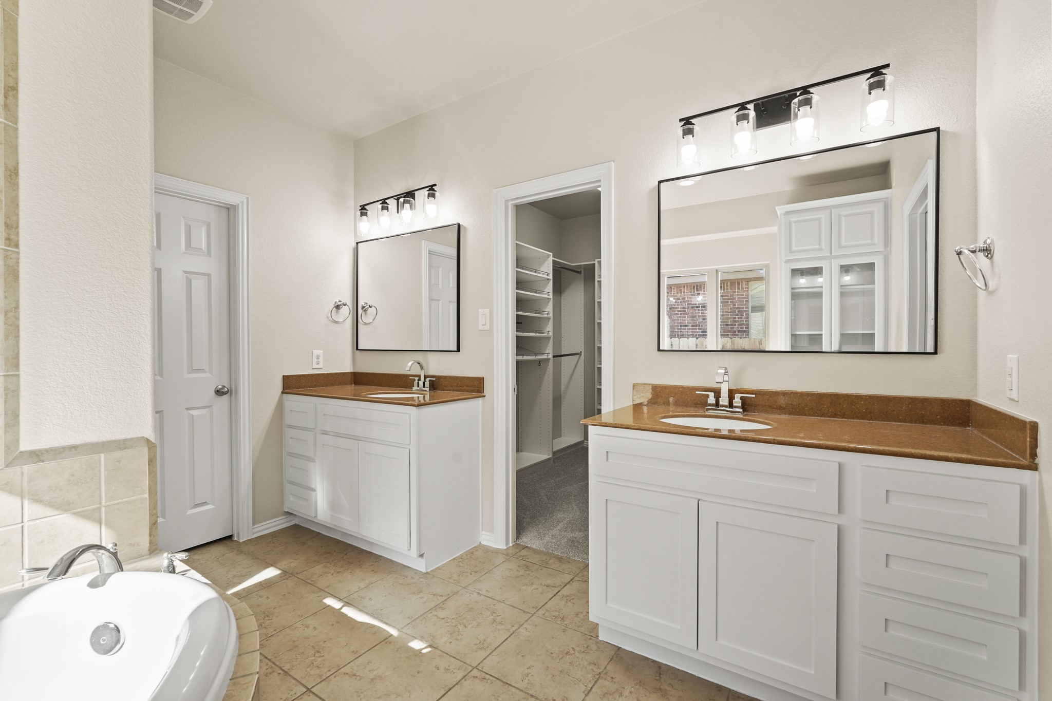 10335 Belvamera Road Richmond, TX 77407 - Photo 17 of 27 a bathroom with a sink and a mirror