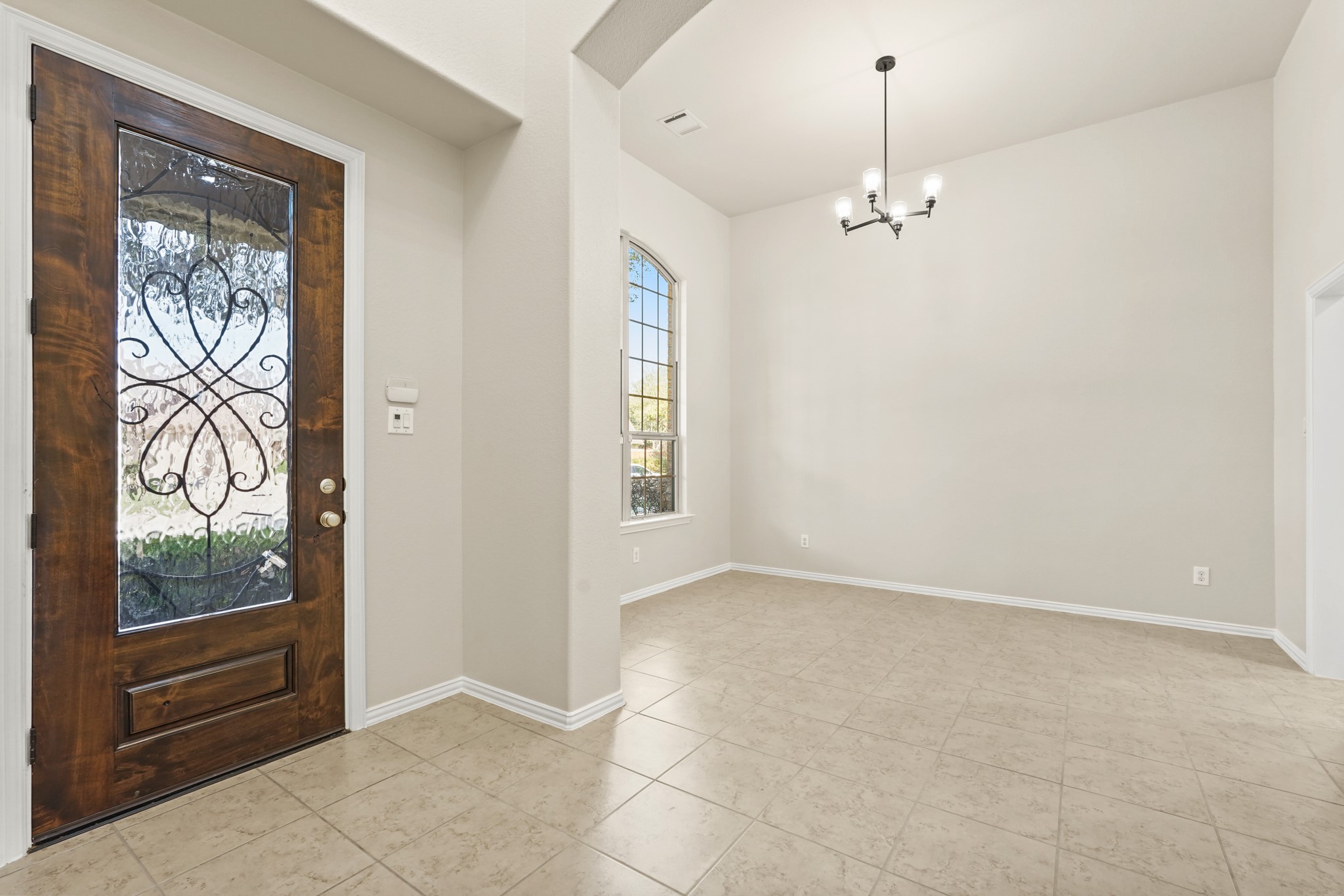 10335 Belvamera Road Richmond, TX 77407 - Photo 3 of 27 en empty room with windows and outdoor