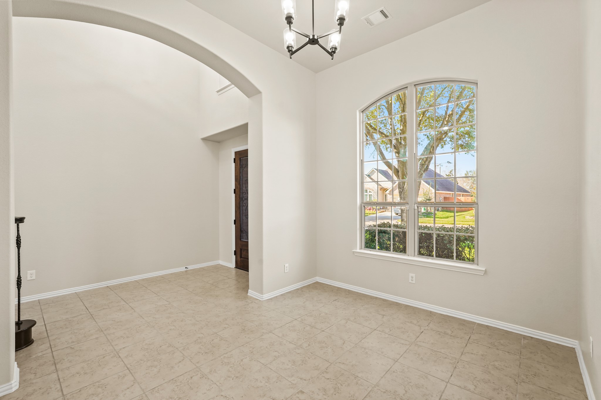10335 Belvamera Road Richmond, TX 77407 - Photo 4 of 27 a view of an empty room with a window
