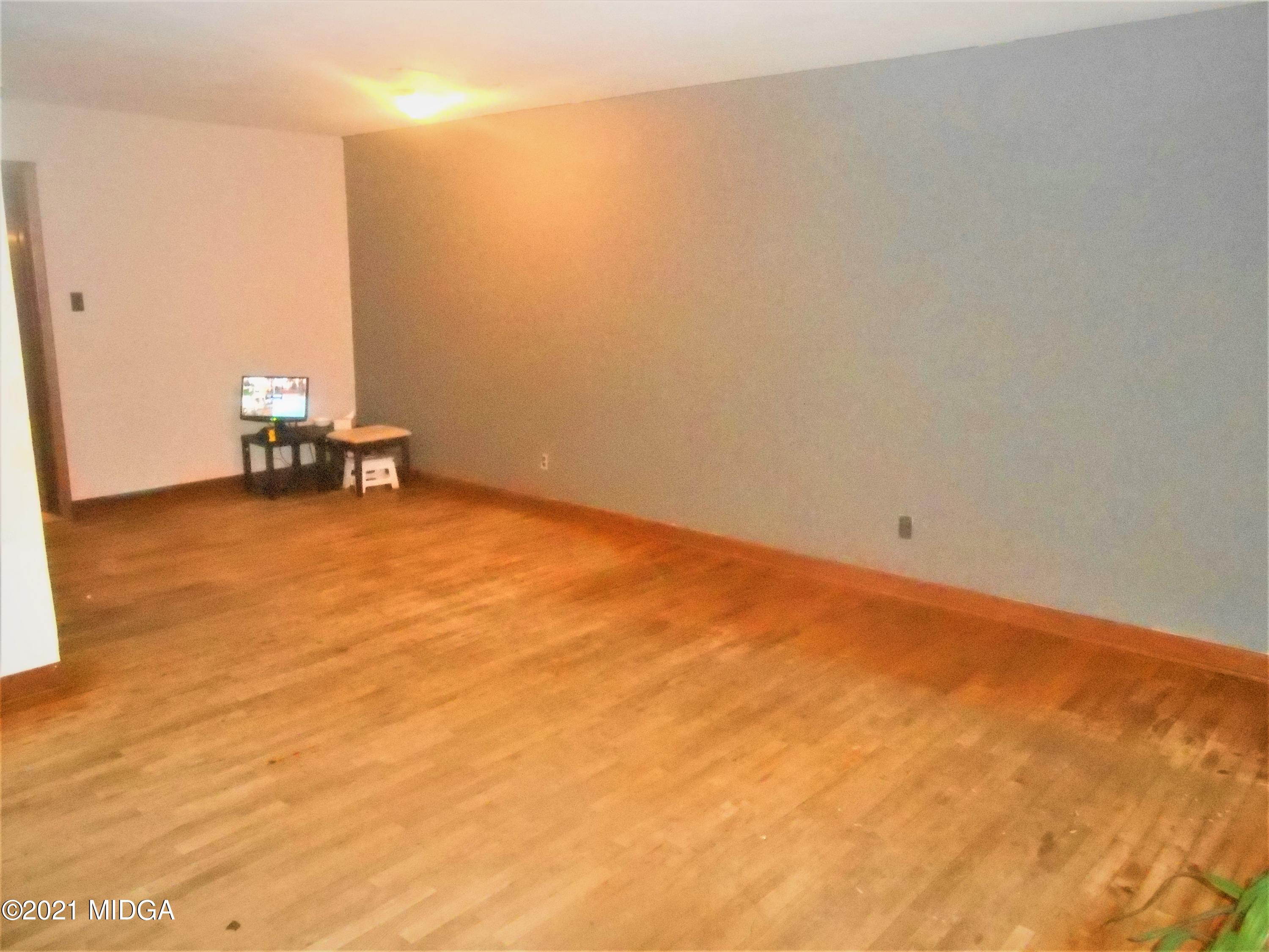 126 Carter Circle Warner Robins, GA 31093 - Photo 8 of 13 an empty room with a barbeque