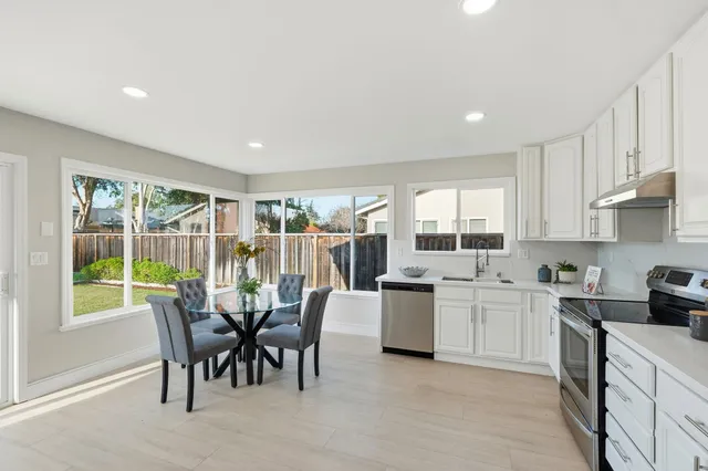 a view of a dining room with furniture window and outside view