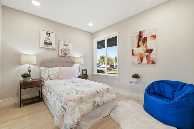 a bedroom with a bed and a couch