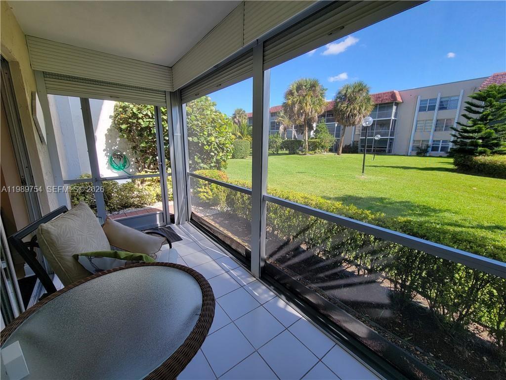 3774 Inverrary Boulevard, Unit 103P Lauderhill, FL 33319 - Photo 34 of 35 a view of swimming pool from a balcony