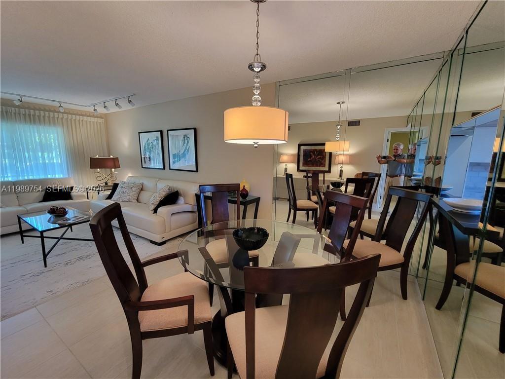 3774 Inverrary Boulevard, Unit 103P Lauderhill, FL 33319 - Photo 8 of 35 a view of a dining room with furniture