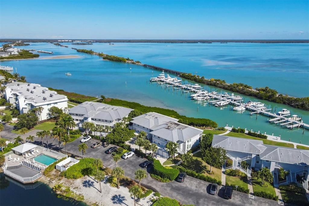 5854 Gasparilla Road, Unit MV20 Boca Grande, FL 33921 - Photo 32 of 49 an aerial view of ocean and residential houses with outdoor space