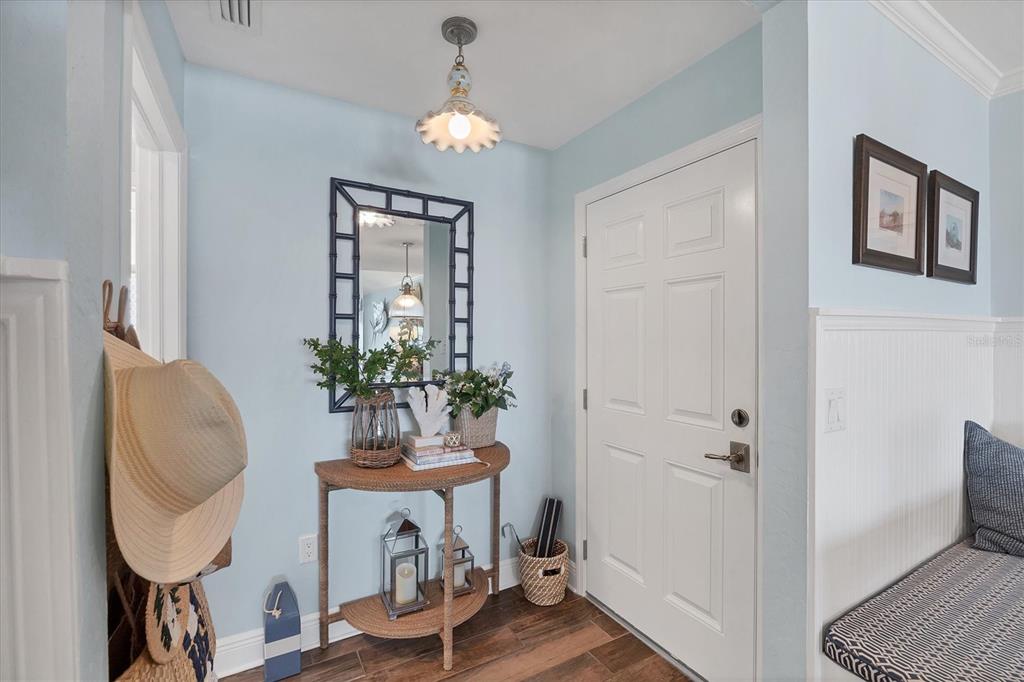 5854 Gasparilla Road, Unit MV20 Boca Grande, FL 33921 - Photo 4 of 49 a view of hall way with furniture and wooden floor