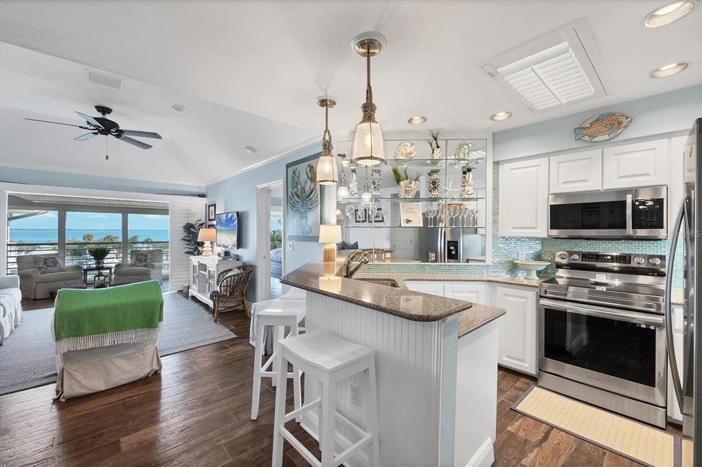5854 Gasparilla Road, Unit MV20 Boca Grande, FL 33921 - Photo 5 of 49 a kitchen with sink stove and cabinets