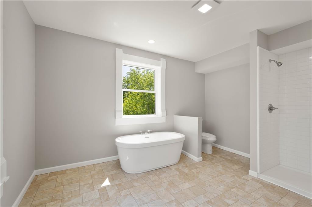 4575 Prosperity Pike Prosperity, PA 15329 - Photo 31 of 46 a bathroom with a white tub sink