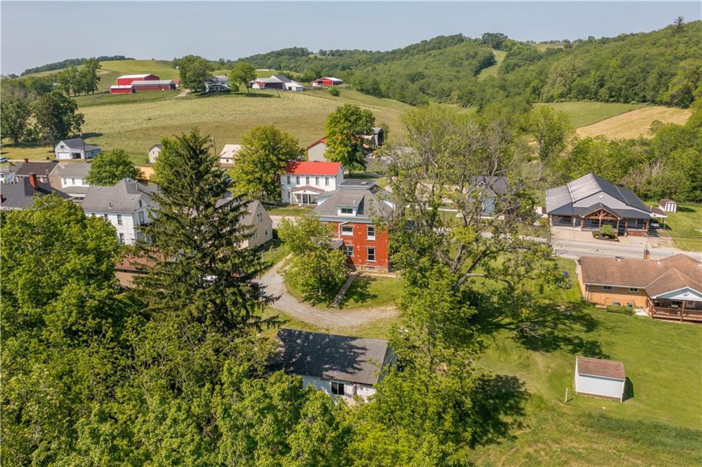 4575 Prosperity Pike Prosperity, PA 15329 - Photo 41 of 46 an aerial view of residential houses with outdoor space and swimming pool
