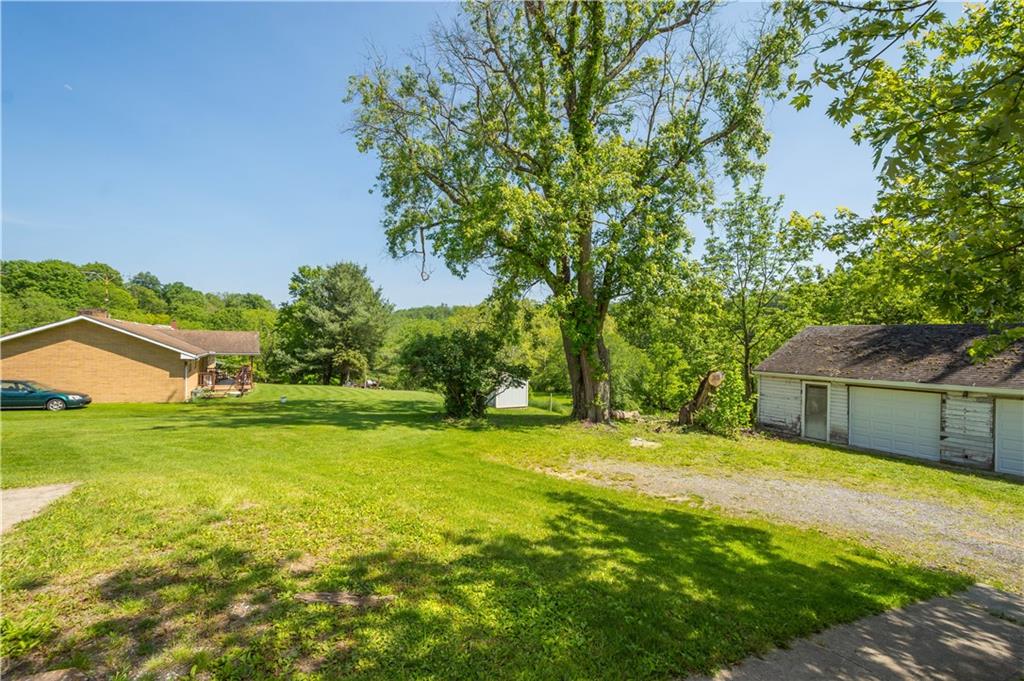 4575 Prosperity Pike Prosperity, PA 15329 - Photo 7 of 46 a swimming pool with a yard and large trees