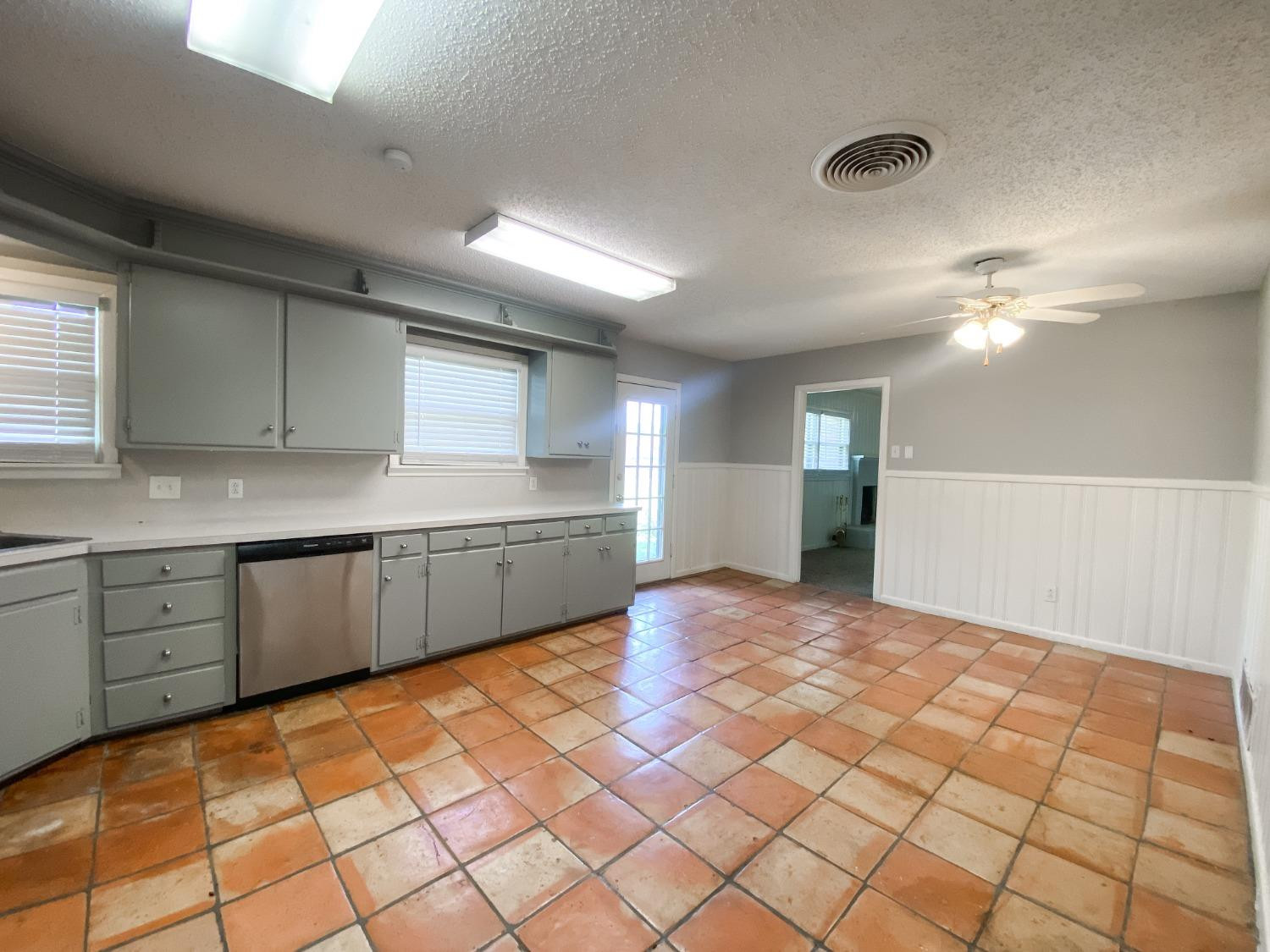 4010 47th Street Lubbock, TX 79413 - Photo 11 of 20 a view of a kitchen with a sink and cabinets