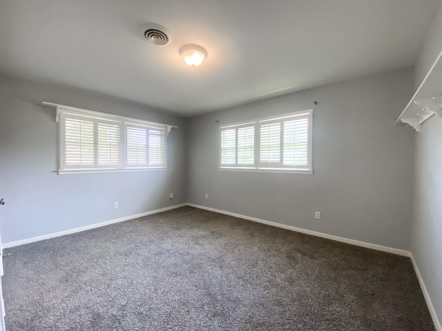 4010 47th Street Lubbock, TX 79413 - Photo 14 of 20 an empty room with windows