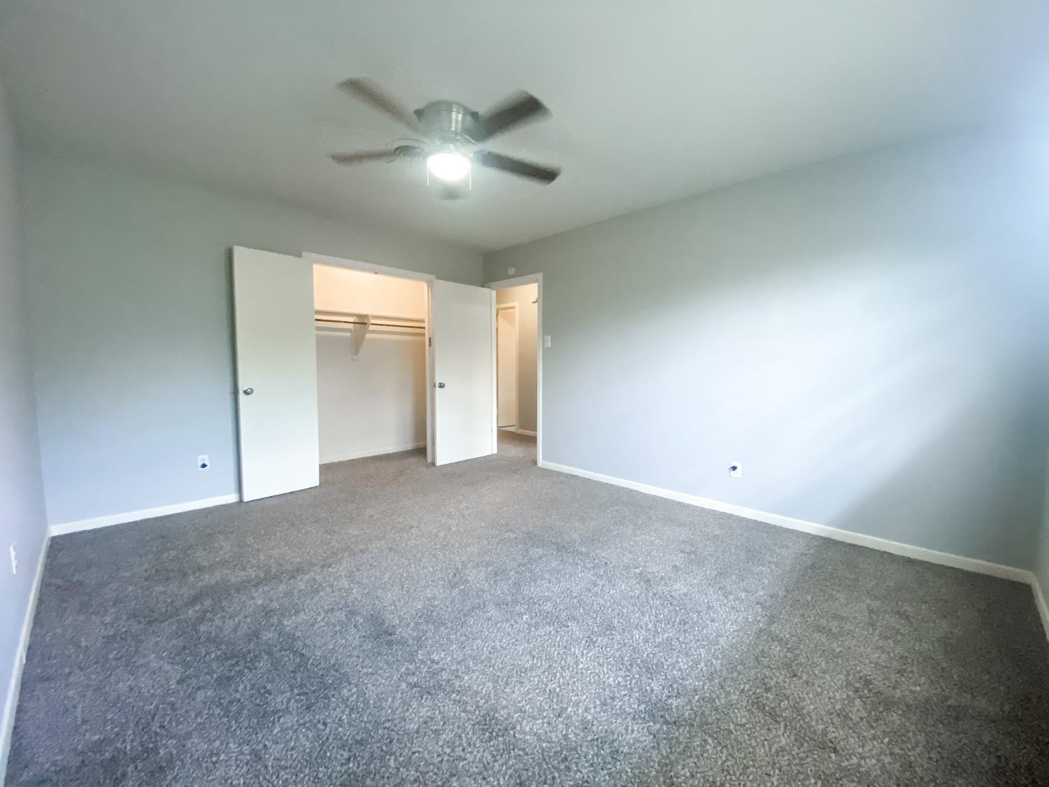 4010 47th Street Lubbock, TX 79413 - Photo 17 of 20 a view of an empty room with a chandelier fan