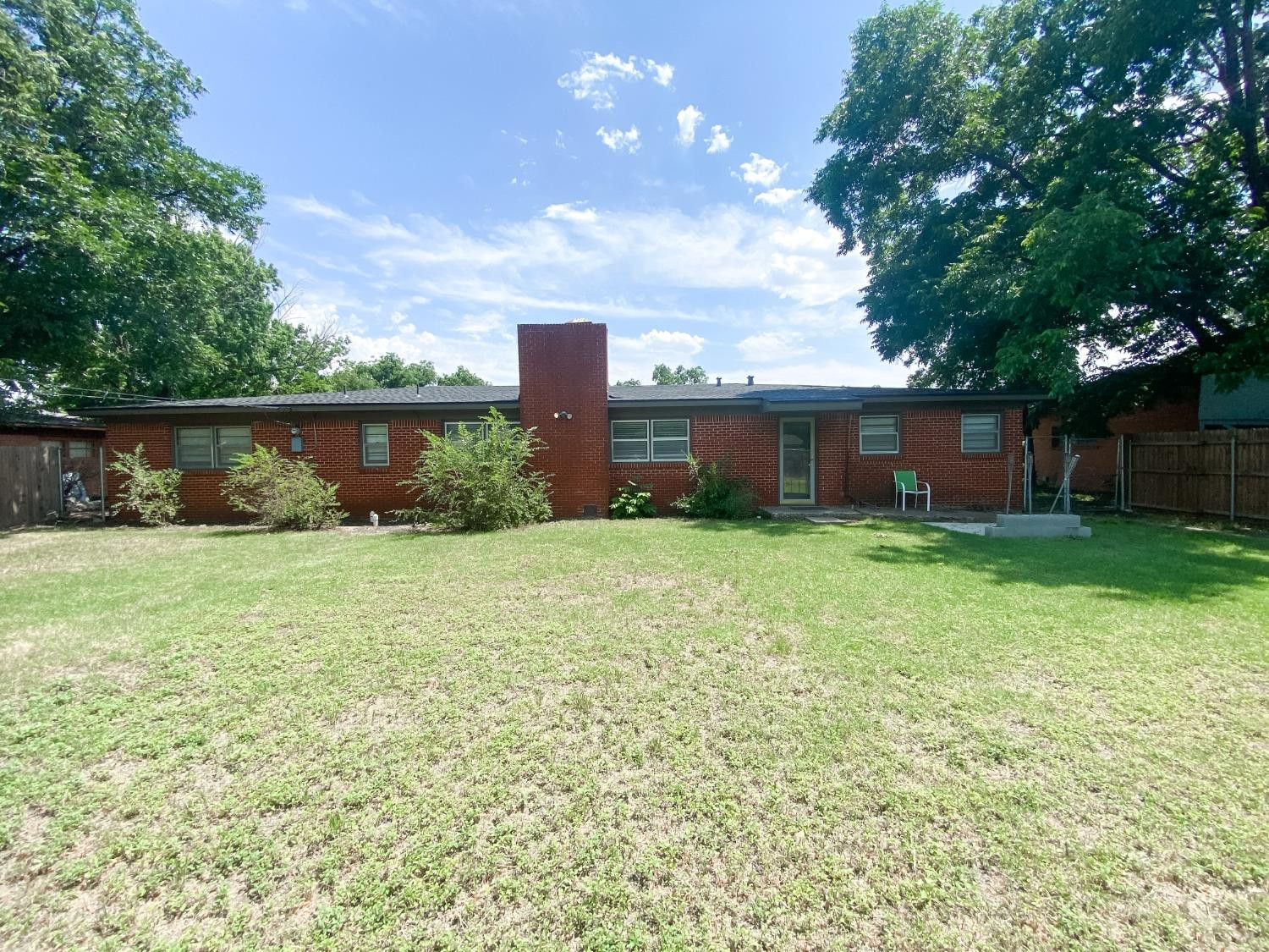 4010 47th Street Lubbock, TX 79413 - Photo 19 of 20 a front view of a house with garden