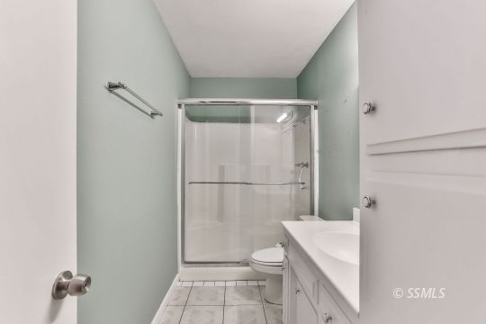 515 South Downs Street Ridgecrest, CA 93555 - Photo 26 of 31 a bathroom with a shower a toilet and a sink