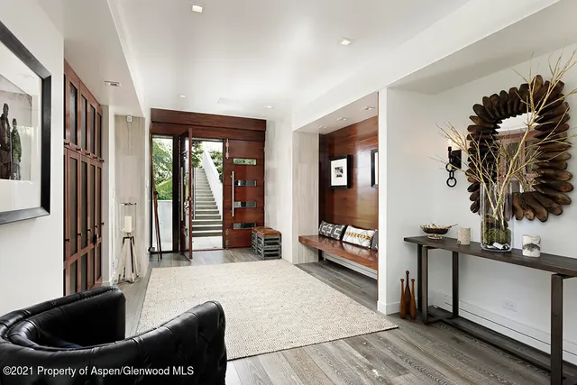 a bed room with a bed and a chair