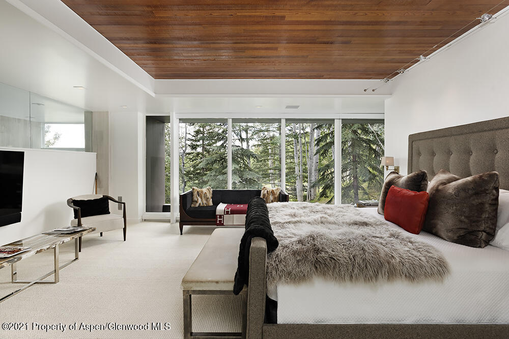 546 Edgewood Lane Snowmass Village, CO 81615 - Photo 14 of 60 a bed room with a bed and a chair