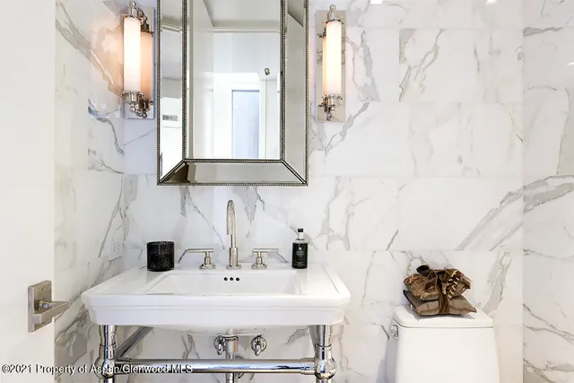 a bedroom with a bed and cabinet