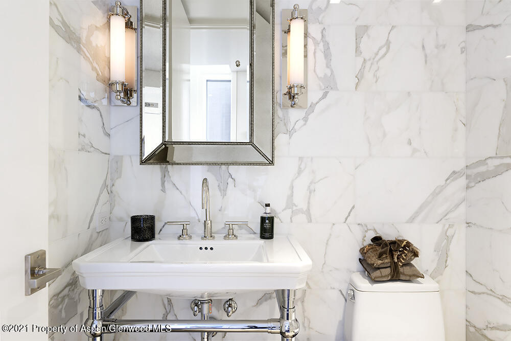 546 Edgewood Lane Snowmass Village, CO 81615 - Photo 21 of 60 a bathroom with a sink and a mirror