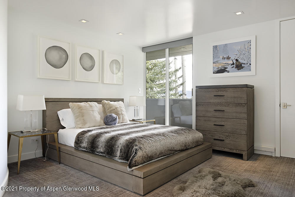 546 Edgewood Lane Snowmass Village, CO 81615 - Photo 22 of 60 a bedroom with a bed and cabinet