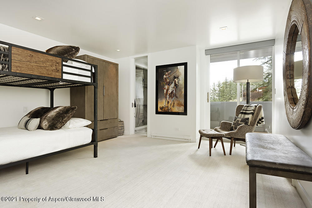 546 Edgewood Lane Snowmass Village, CO 81615 - Photo 23 of 60 a living room with furniture and a flat screen tv