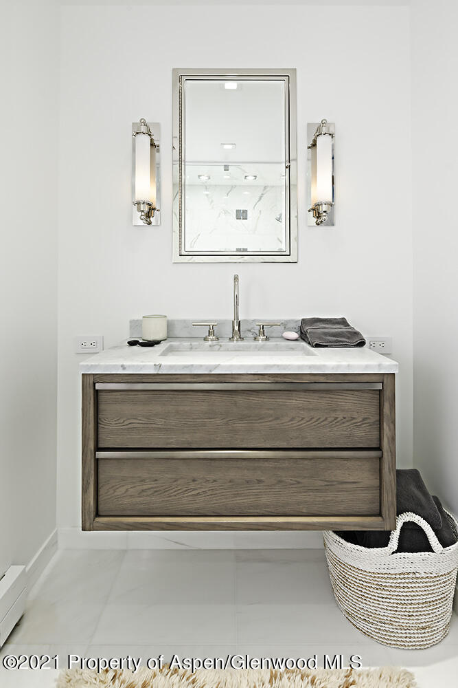 546 Edgewood Lane Snowmass Village, CO 81615 - Photo 24 of 60 a bathroom with a sink and a mirror