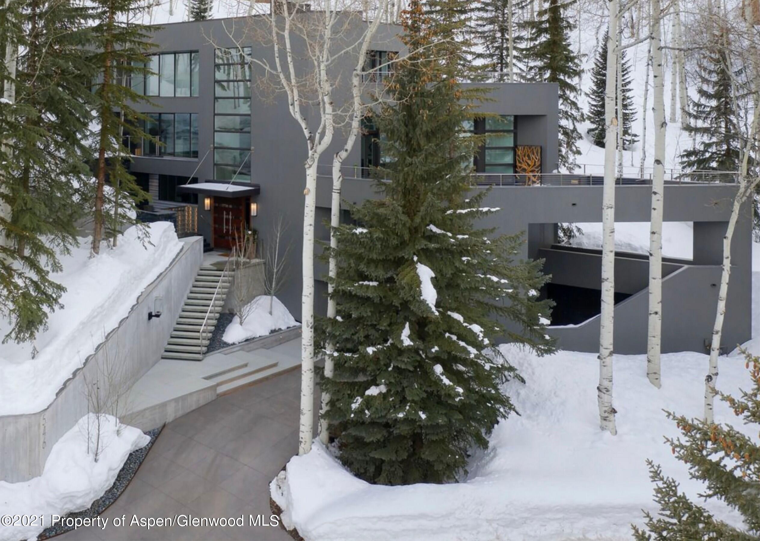546 Edgewood Lane Snowmass Village, CO 81615 - Photo 26 of 60 a view of a house with a yard