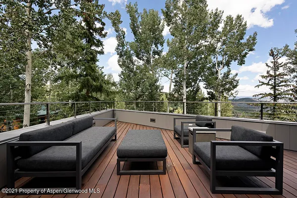 a view of chair and tables in the patio