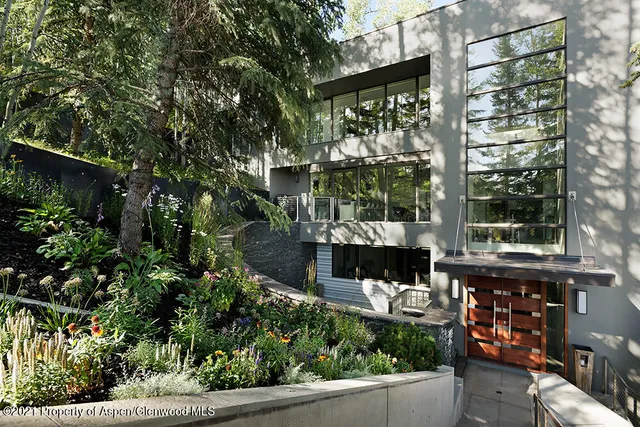 a balcony with tall trees