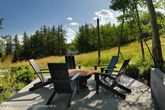 a bathroom with a sink a mirror and a shower