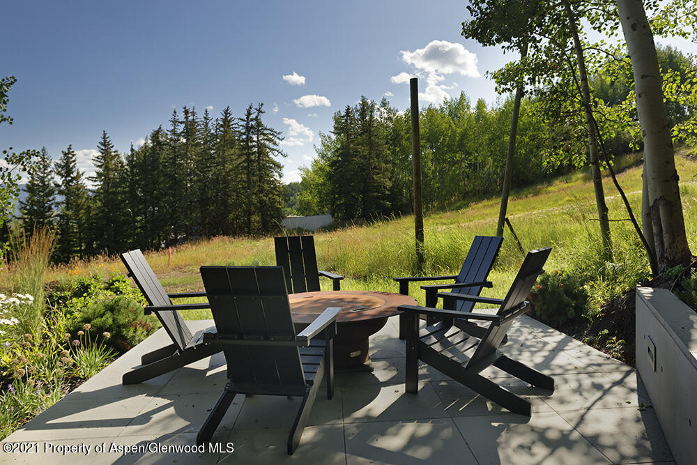 546 Edgewood Lane Snowmass Village, CO 81615 - Photo 36 of 60 a view of chair and tables in the patio