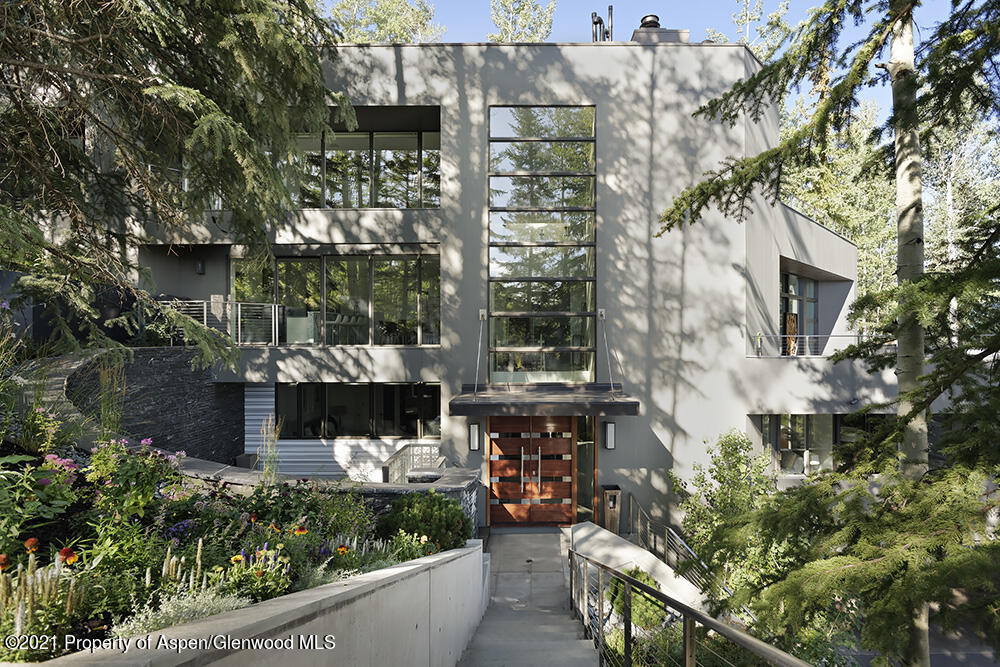 546 Edgewood Lane Snowmass Village, CO 81615 - Photo 37 of 60 a balcony with tall trees