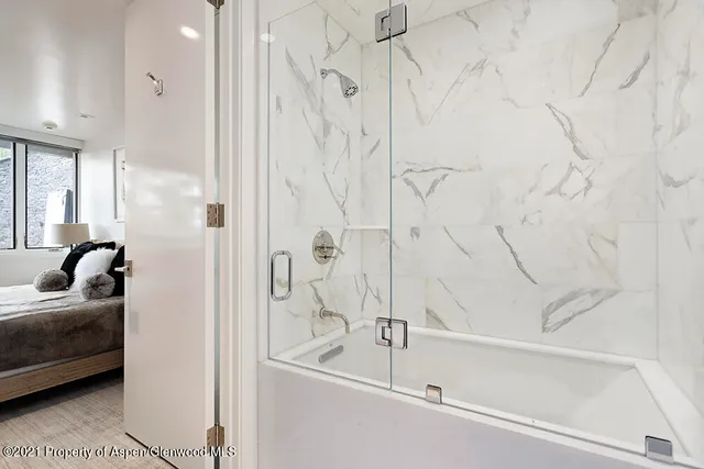 a view of balcony with wooden floor and seating space
