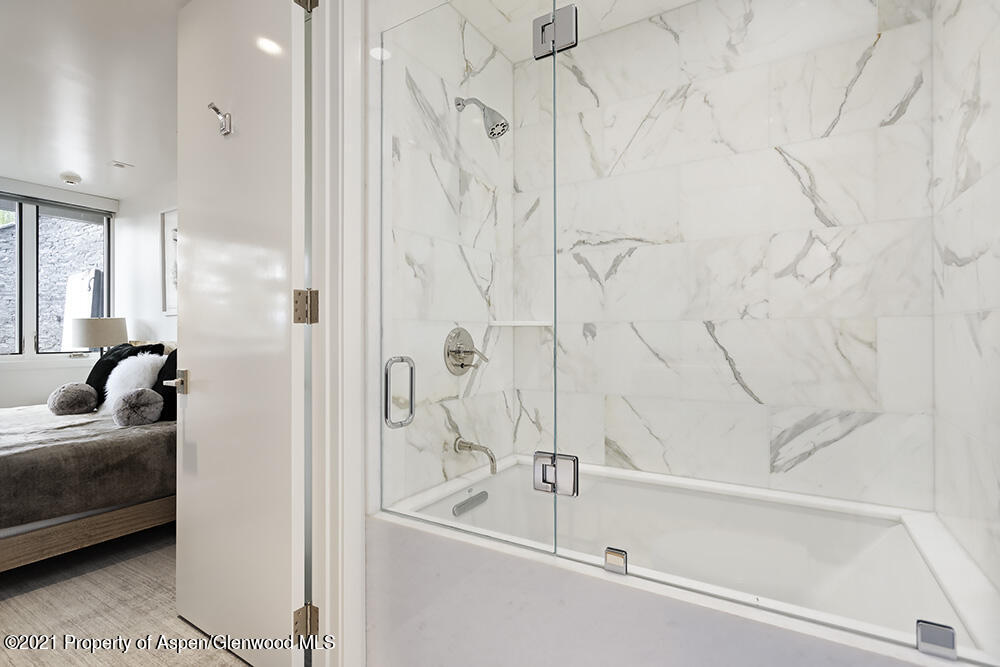 546 Edgewood Lane Snowmass Village, CO 81615 - Photo 40 of 60 a bathroom with a bathtub and a shower