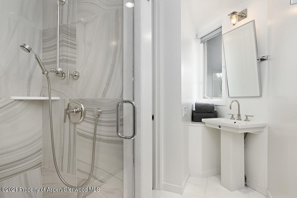546 Edgewood Lane Snowmass Village, CO 81615 - Photo 42 of 60 a bathroom with a sink a toilet and shower